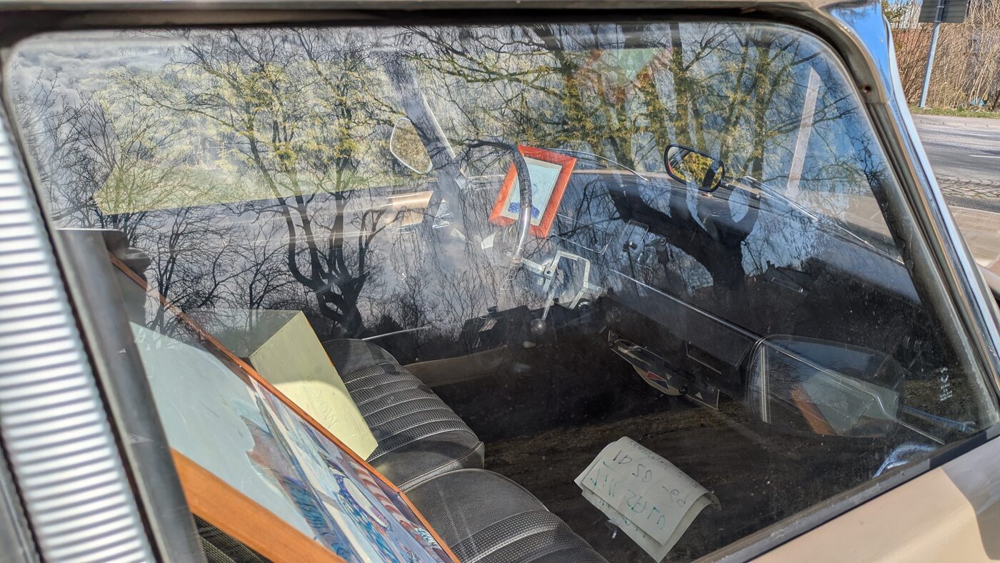 A painting seen through the windscreen of the car
